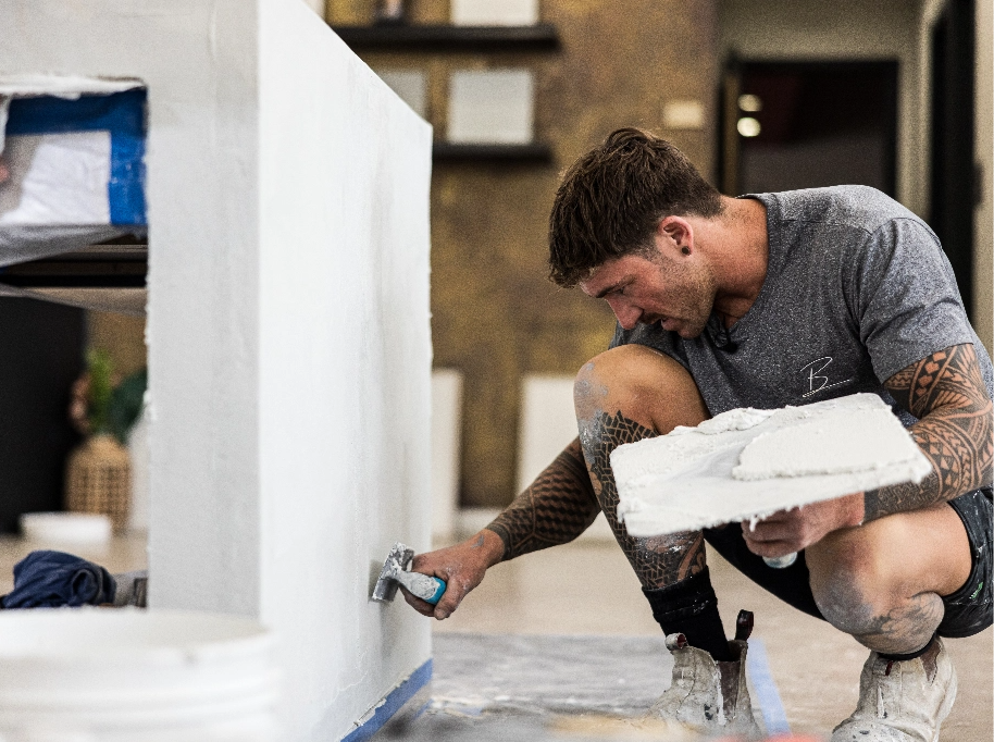 Tradesman applying micro cement product.