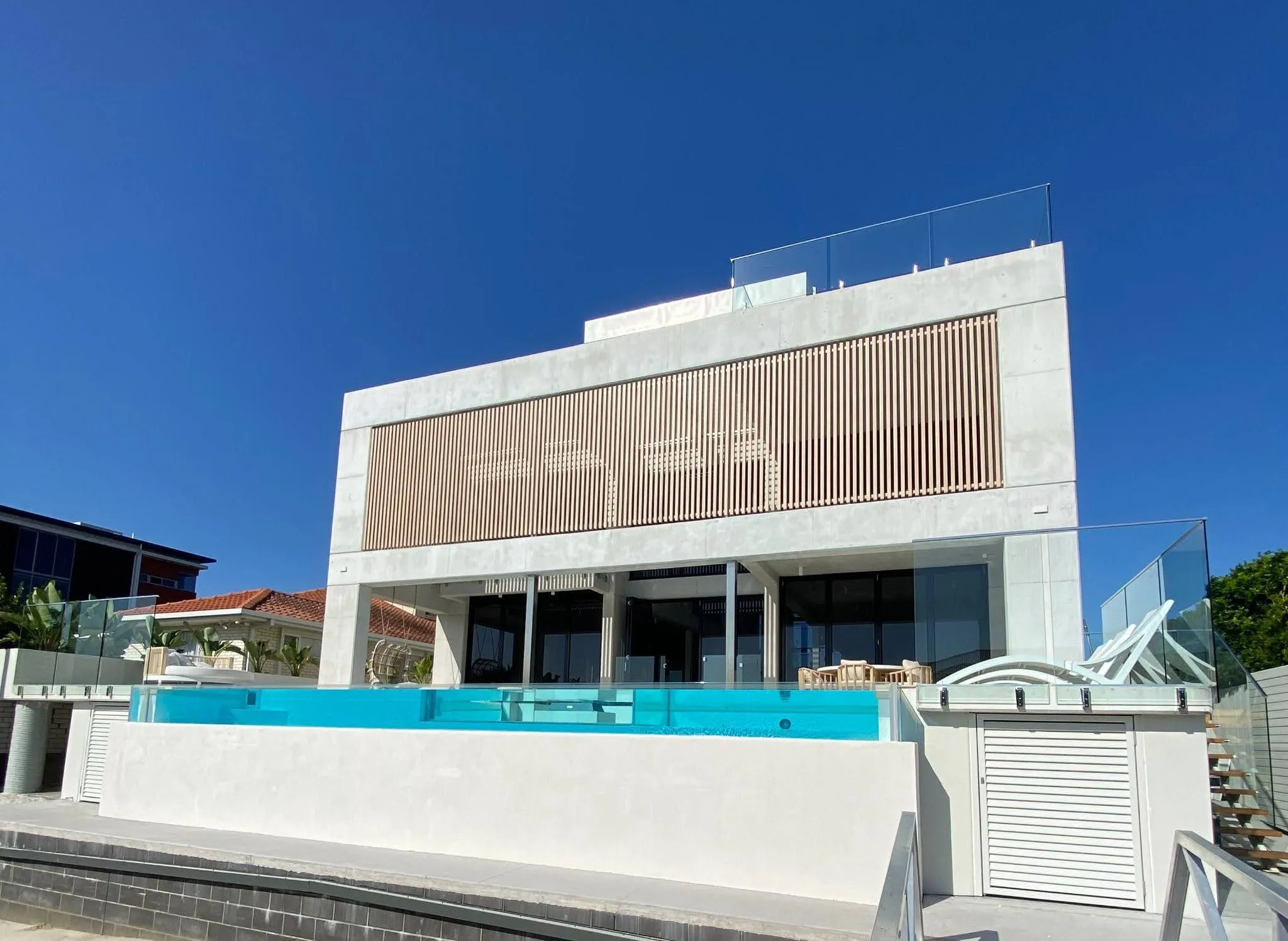 Landscape image of modern house with lap pool